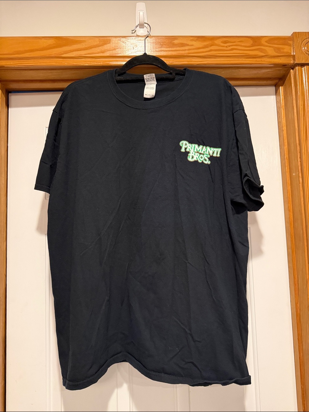 Gildan Black Short-Sleeve Tee with Green Primanti Bros. Chest Logo